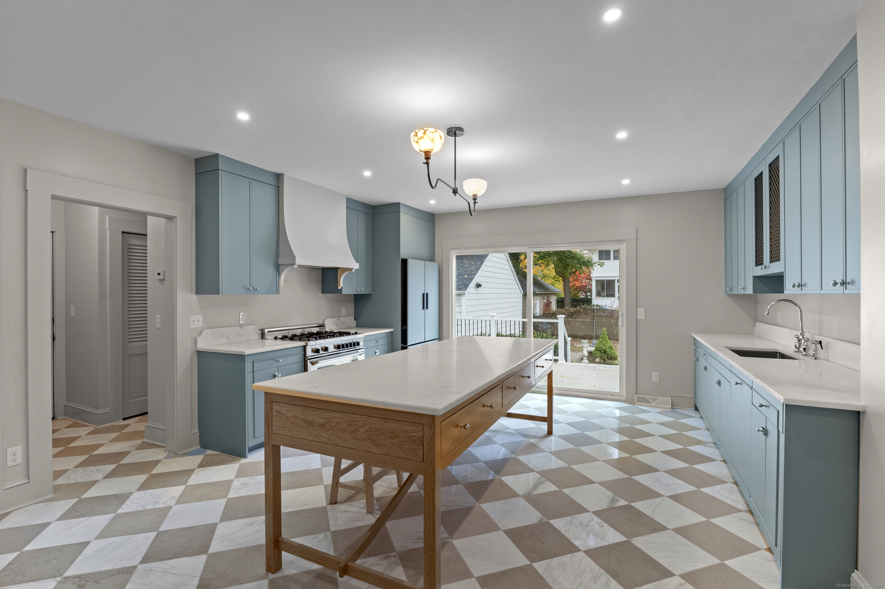 119 Westwood Road New Haven, CT 06515 - Photo 11 of 40 a kitchen with stainless steel appliances granite countertop a sink and a refrigerator