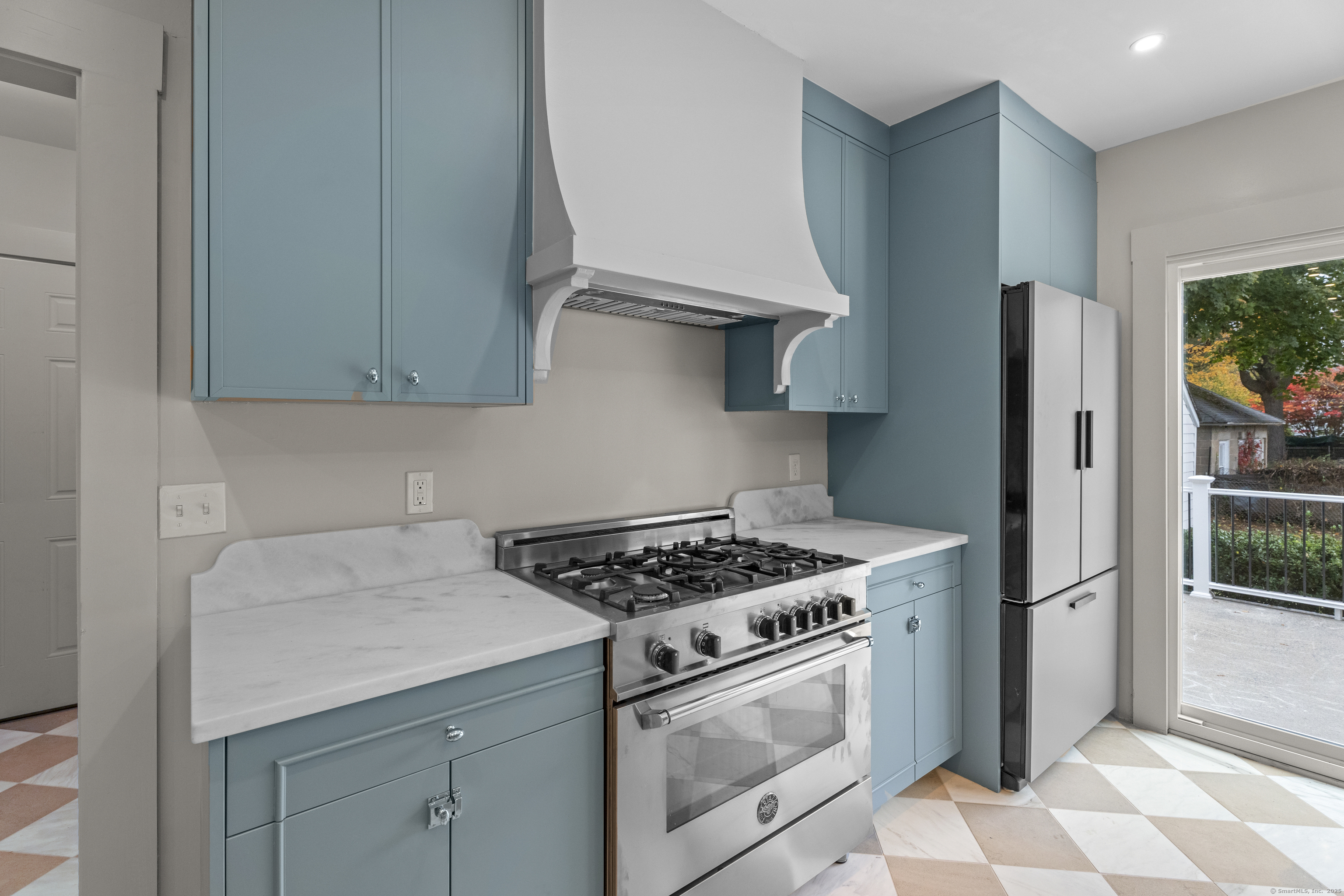 119 Westwood Road New Haven, CT 06515 - Photo 13 of 40 a kitchen with stainless steel appliances granite countertop a sink stove and refrigerator