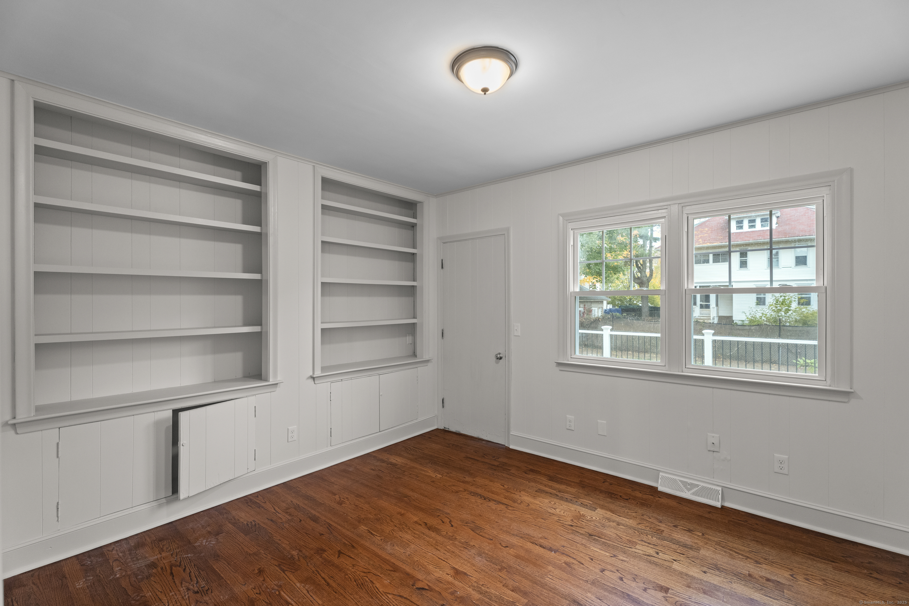 119 Westwood Road New Haven, CT 06515 - Photo 19 of 40 a view of empty room with wooden floor and fan