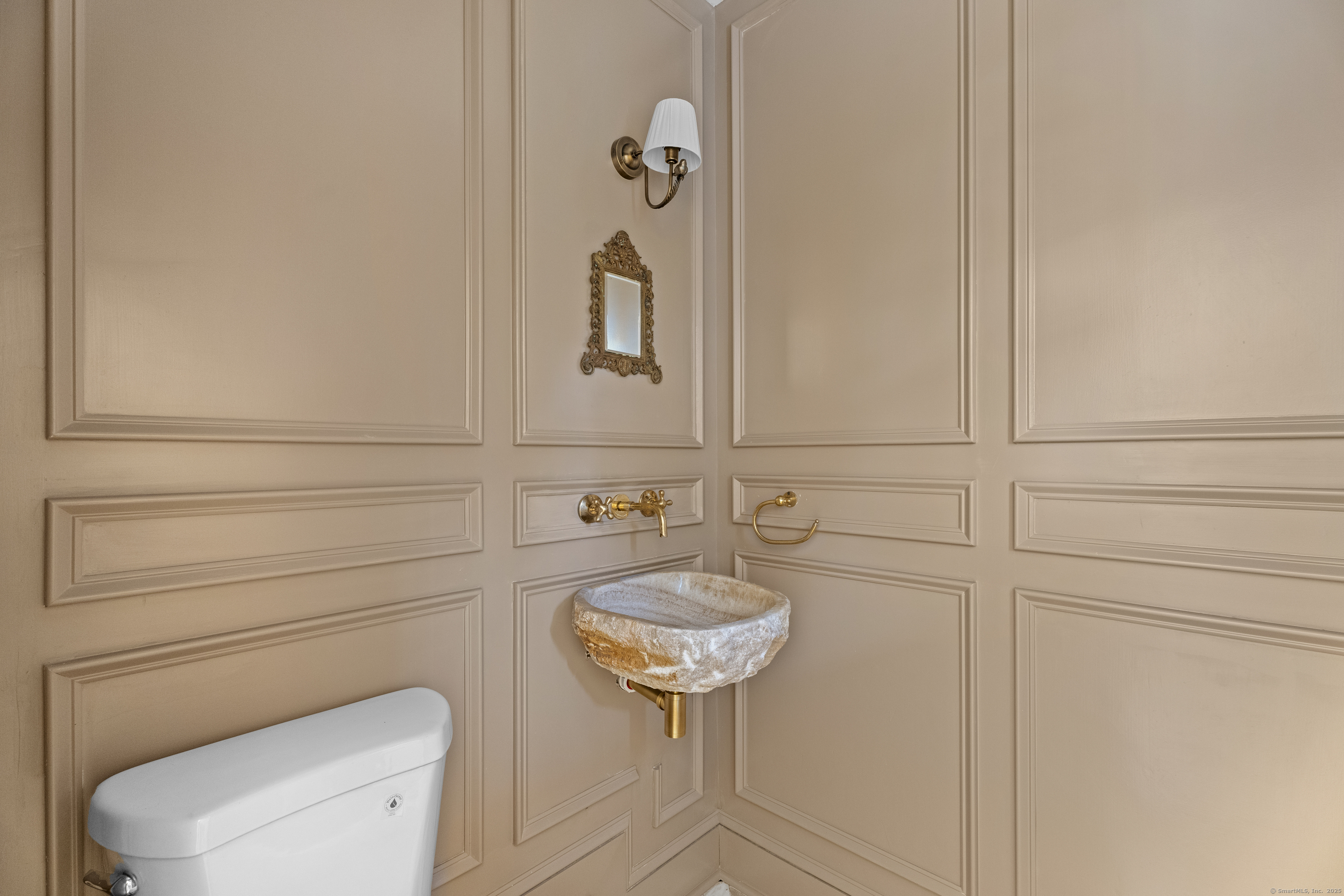 119 Westwood Road New Haven, CT 06515 - Photo 20 of 40 a bathroom with a toilet a sink and mirror