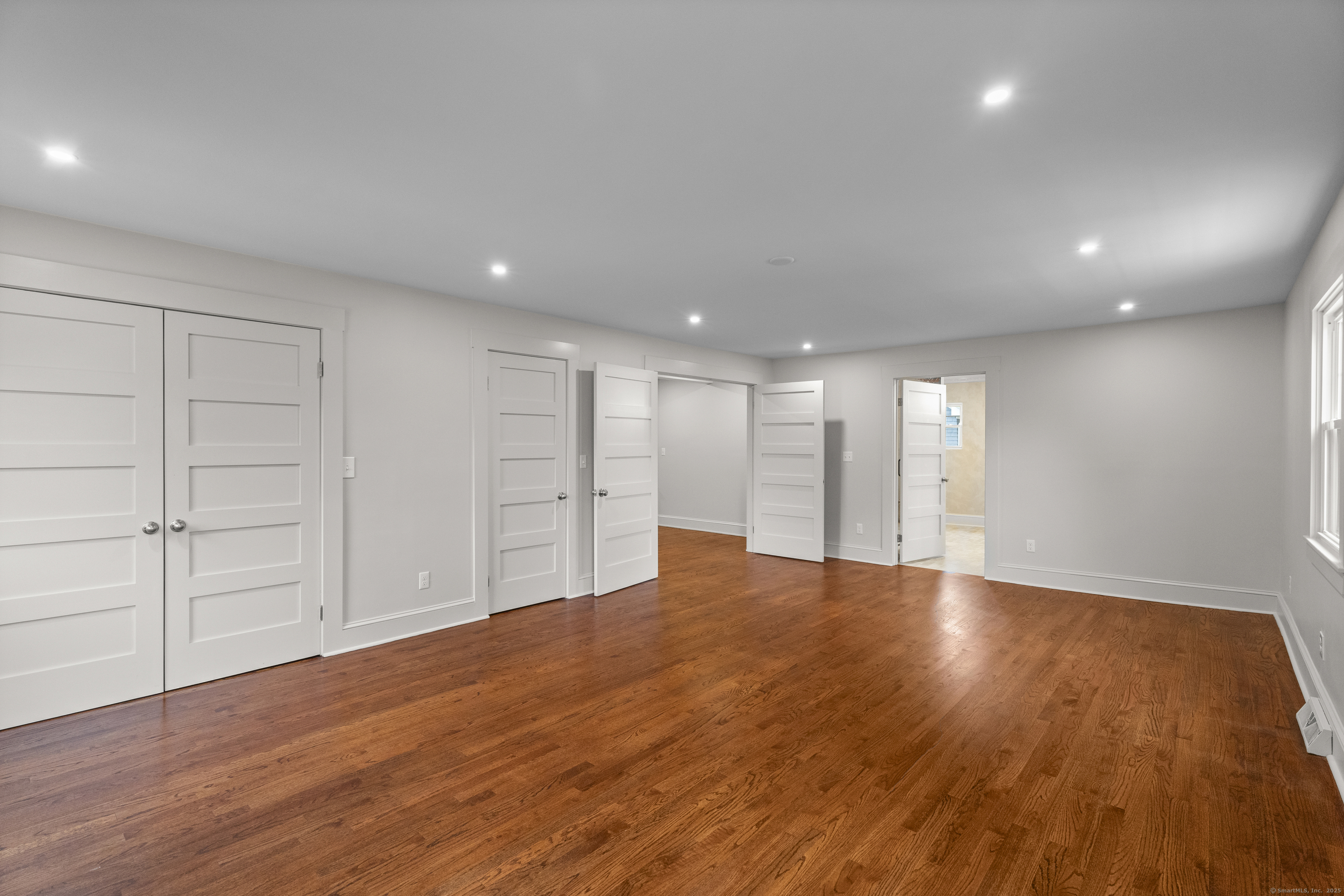 119 Westwood Road New Haven, CT 06515 - Photo 21 of 40 a view of an empty room with wooden floor