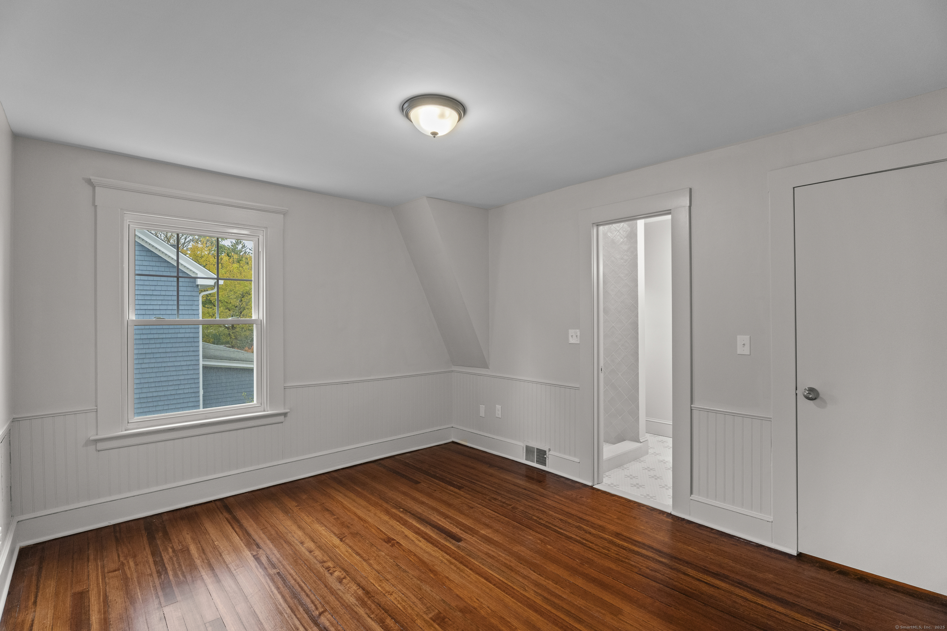119 Westwood Road New Haven, CT 06515 - Photo 27 of 40 a view of empty room with wooden floor and fan