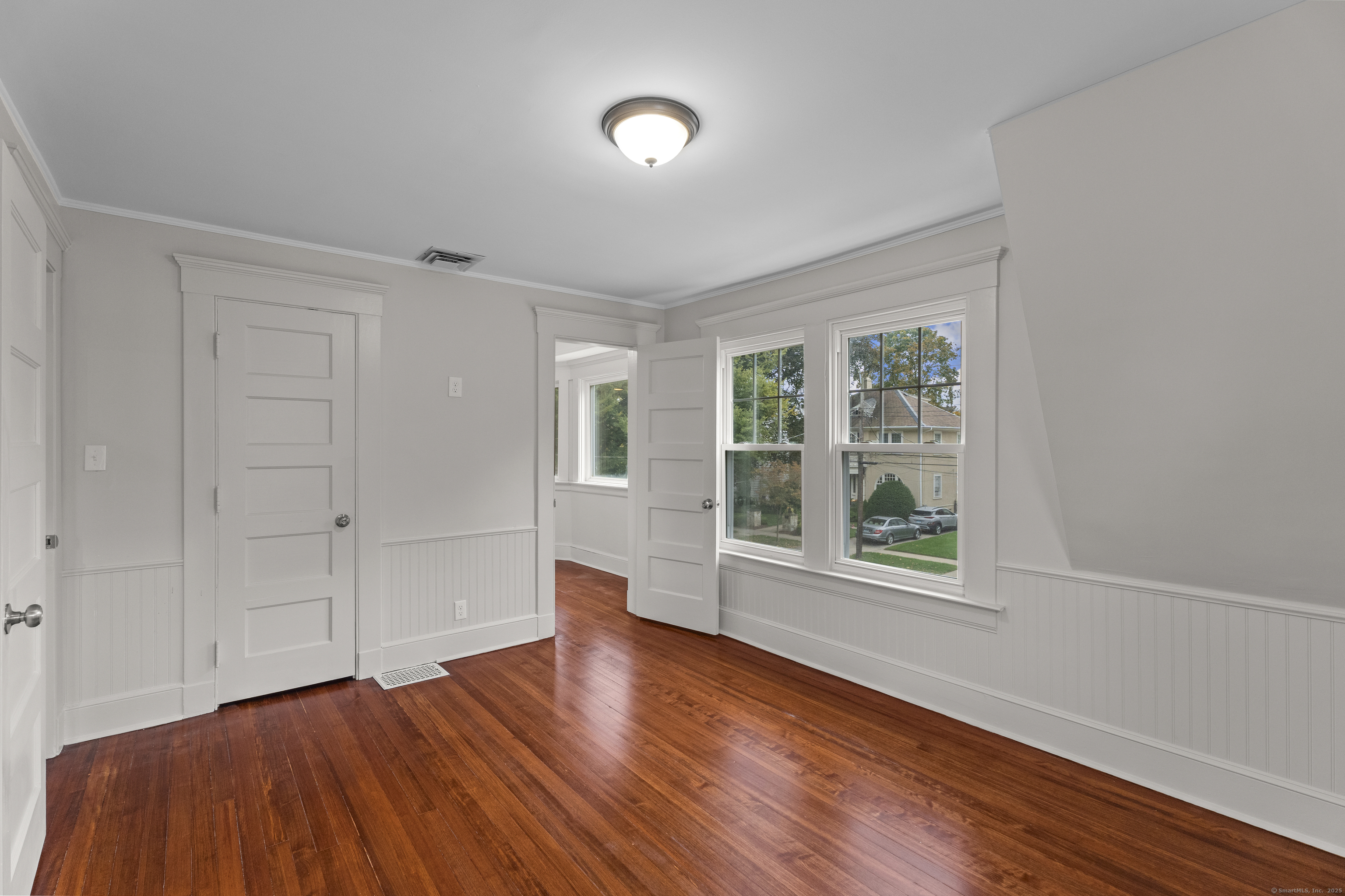 119 Westwood Road New Haven, CT 06515 - Photo 33 of 40 wooden floor in an empty room with a window