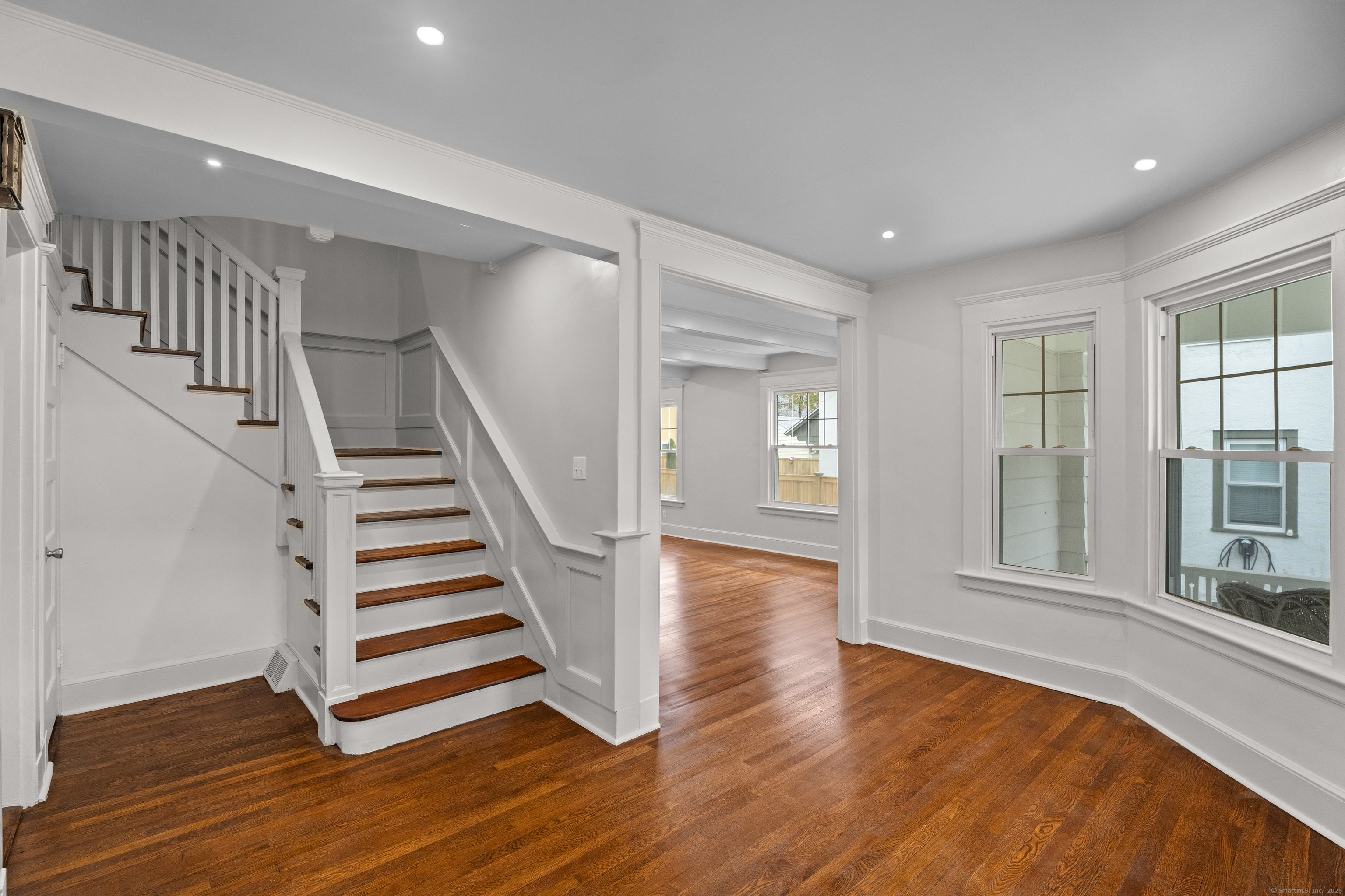 119 Westwood Road New Haven, CT 06515 - Photo 6 of 40 a view of a room with stairs and wooden floor