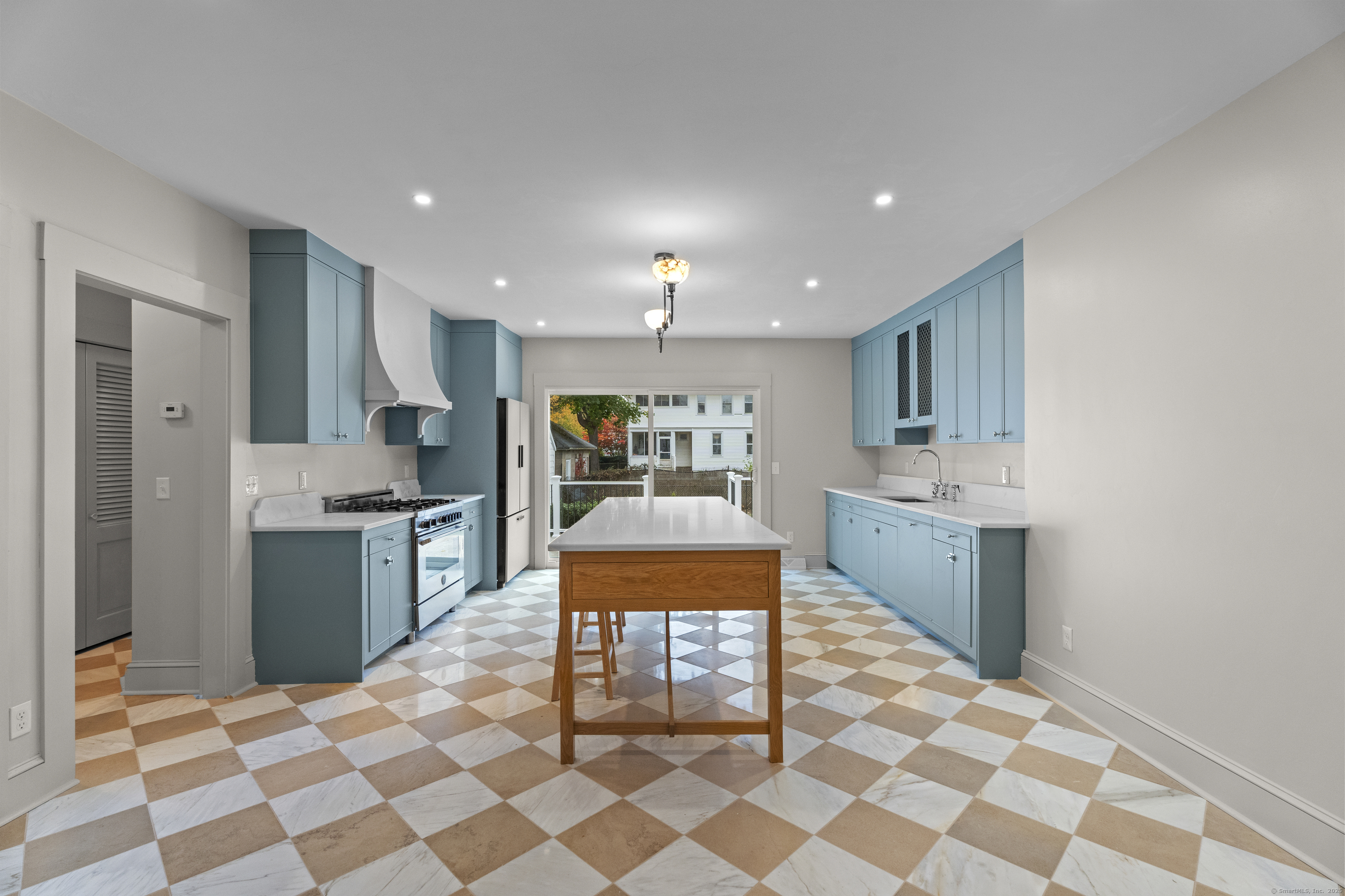 119 Westwood Road New Haven, CT 06515 - Photo 10 of 40 a large kitchen with a sink and stainless steel appliances