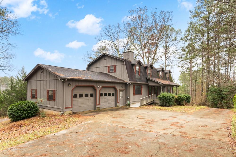 57 Duvall Way Acworth, GA 30101 - Photo 1 of 1 a front view of a house with a yard