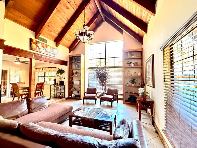 an outdoor sitting area with a table and chairs