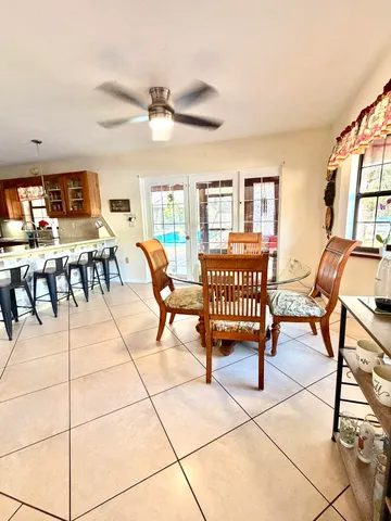a swimming pool table and chairs