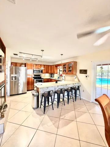 a view of a kitchen with furniture and a fireplace