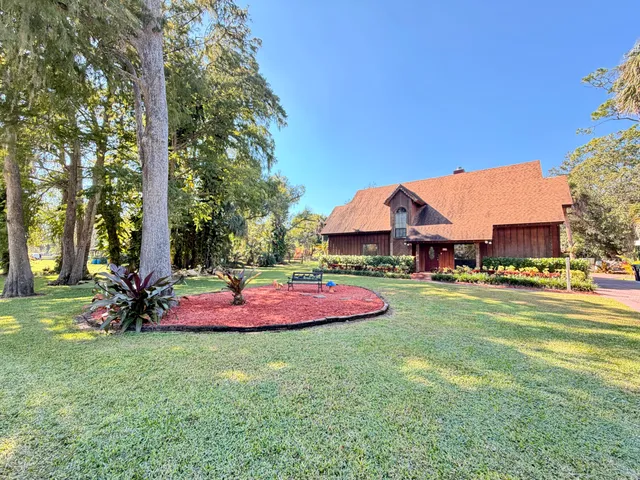 a view of a house with a big yard