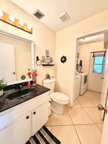 a bedroom with a bed dresser and a window