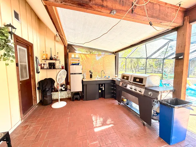 a view of a swimming pool with a patio