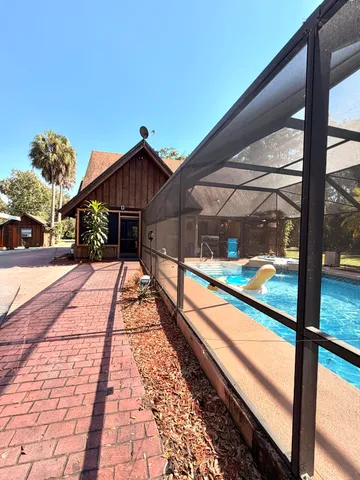 a view of a swimming pool with an outdoor seating