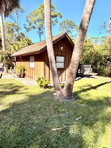 a view of a pathway both side of the house