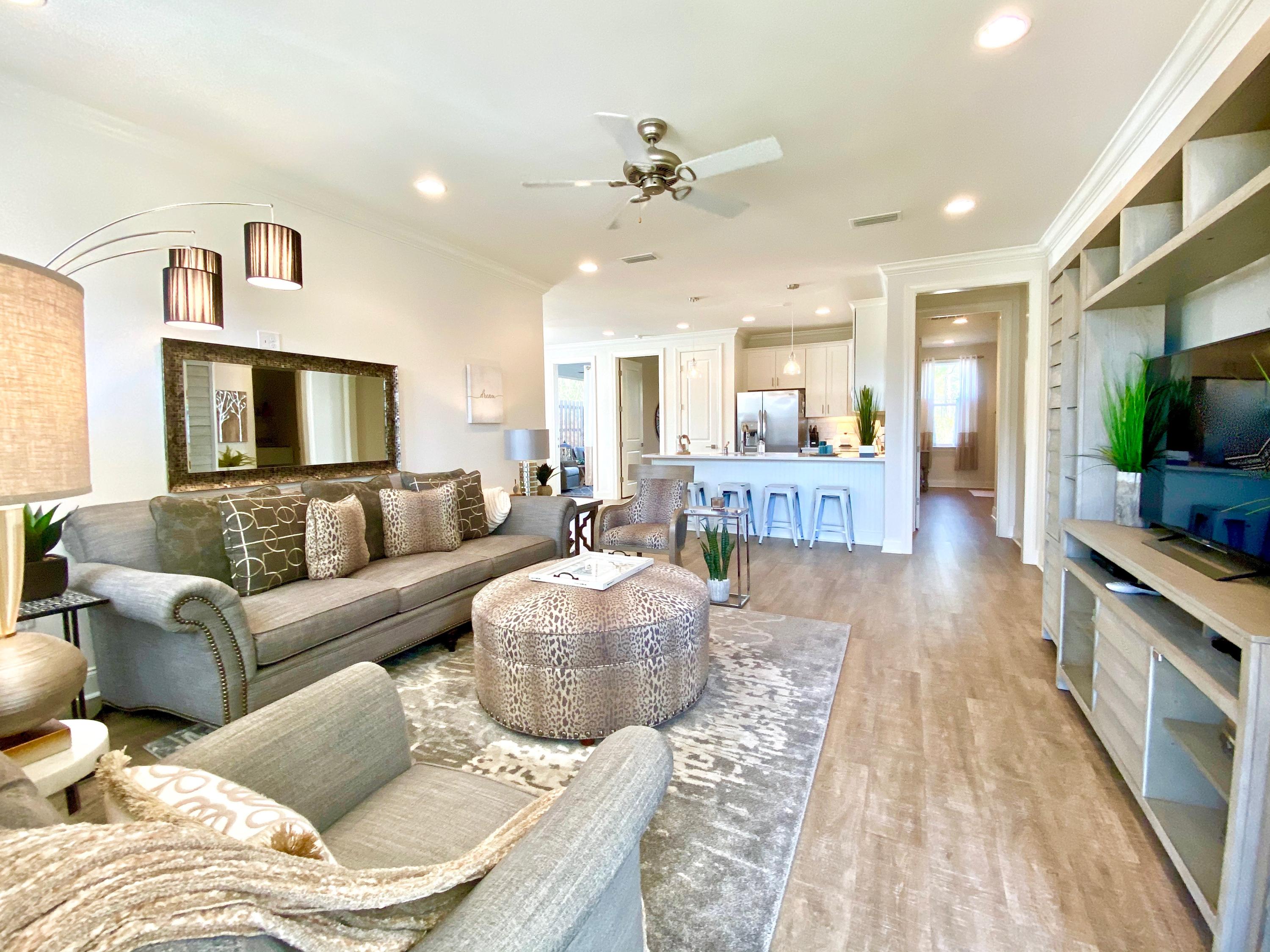 100 North Zander Way Santa Rosa Beach, FL 32459 - Photo 11 of 50 a living room with furniture and a flat screen tv