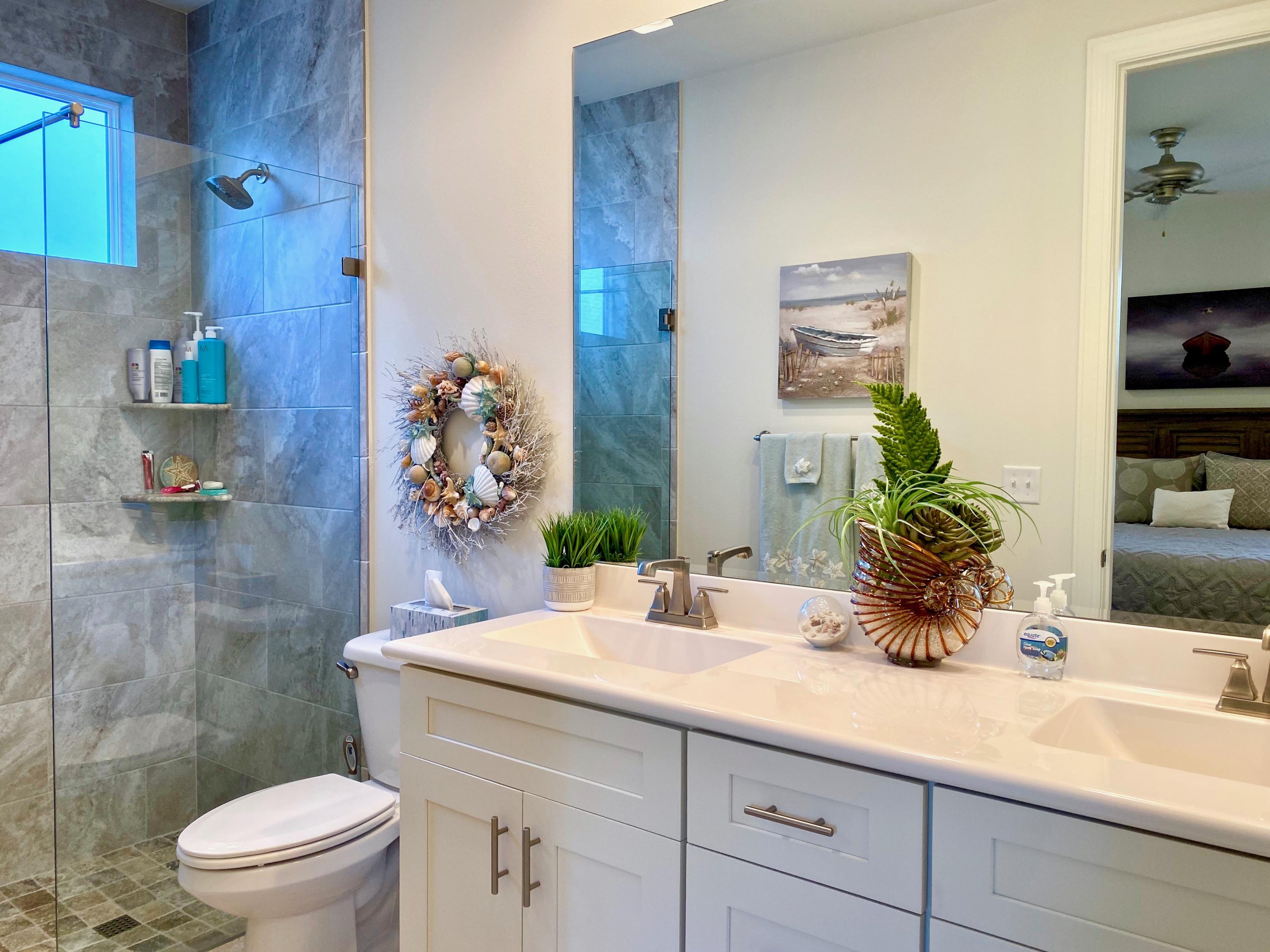 100 North Zander Way Santa Rosa Beach, FL 32459 - Photo 23 of 50 a bathroom with a sink a toilet and shower