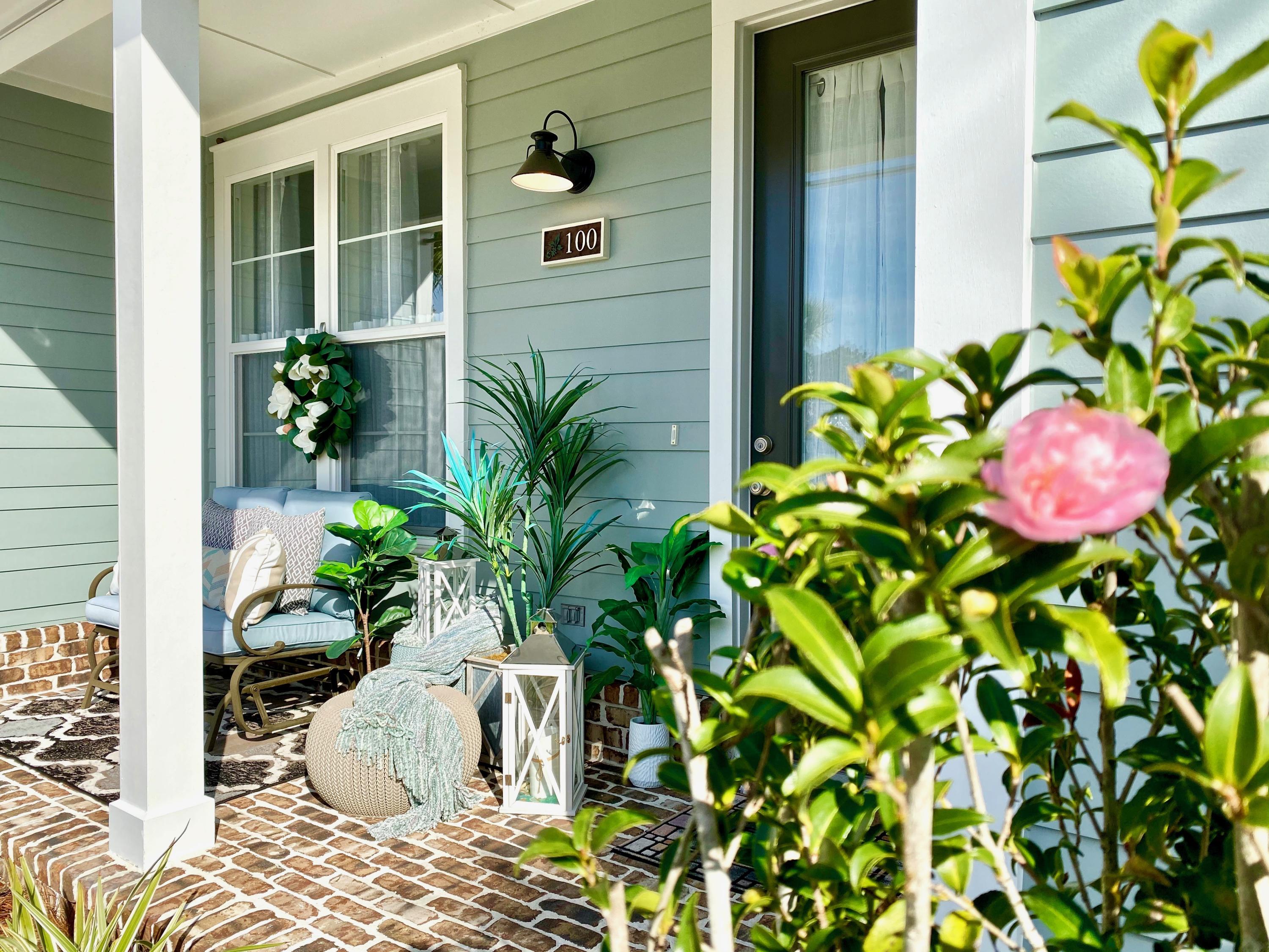 100 North Zander Way Santa Rosa Beach, FL 32459 - Photo 6 of 50 a potted plant sitting in front of a door