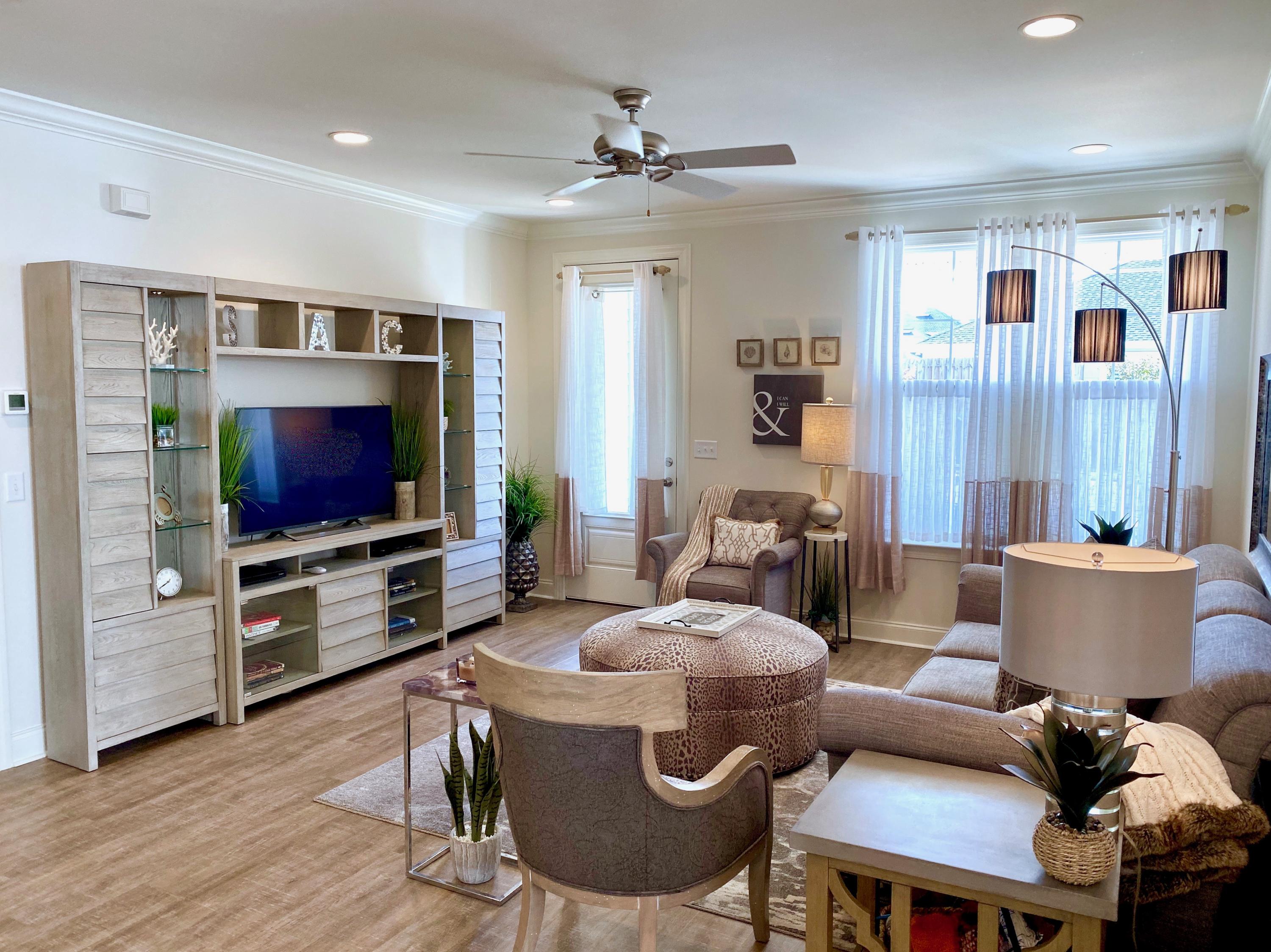 100 North Zander Way Santa Rosa Beach, FL 32459 - Photo 8 of 50 a living room with furniture and a flat screen tv
