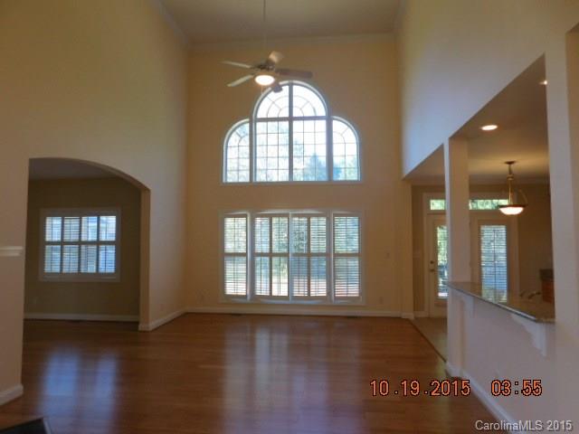 10004 Paradise Ridge Road, Unit 68 Charlotte, NC 28277 - Photo 11 of 24 wooden floor in an empty room with a window
