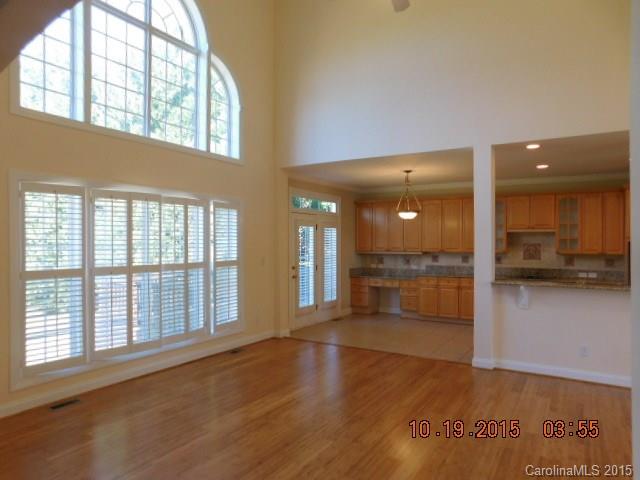 10004 Paradise Ridge Road, Unit 68 Charlotte, NC 28277 - Photo 12 of 24 wooden floor in an empty room with a window