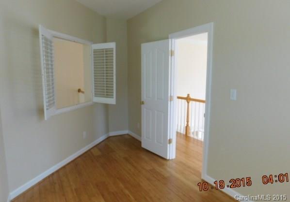 10004 Paradise Ridge Road, Unit 68 Charlotte, NC 28277 - Photo 17 of 24 a view of hallway with stairs and wooden floor
