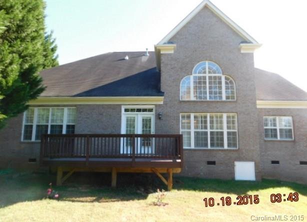 10004 Paradise Ridge Road, Unit 68 Charlotte, NC 28277 - Photo 22 of 24 a front view of a house with yard wooden fence and a porch