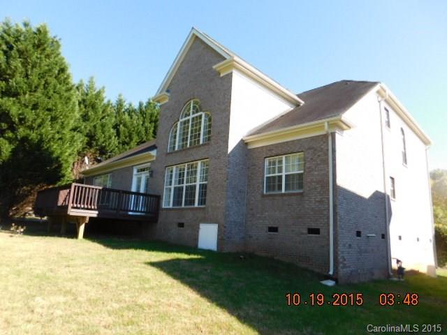 10004 Paradise Ridge Road, Unit 68 Charlotte, NC 28277 - Photo 23 of 24 a view of a house with a yard