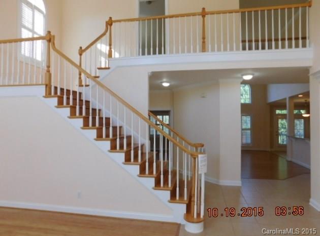 10004 Paradise Ridge Road, Unit 68 Charlotte, NC 28277 - Photo 5 of 24 wooden floor with windows and stairs