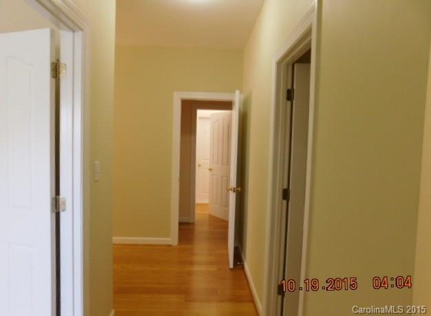 10004 Paradise Ridge Road, Unit 68 Charlotte, NC 28277 - Photo 6 of 24 a view of a bathroom with a glass door