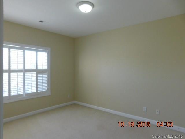 10004 Paradise Ridge Road, Unit 68 Charlotte, NC 28277 - Photo 7 of 24 an empty room with a window