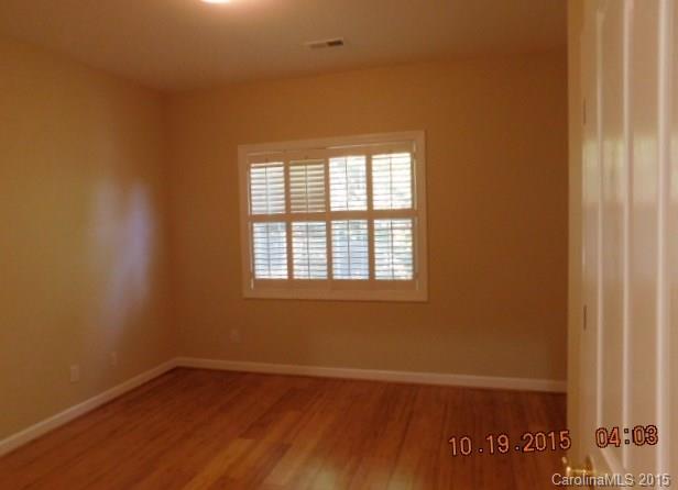 10004 Paradise Ridge Road, Unit 68 Charlotte, NC 28277 - Photo 8 of 24 an empty room with a window
