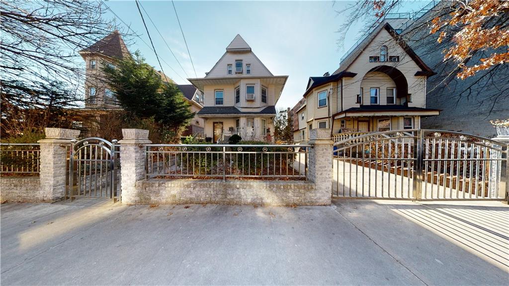 3216 Glenwood Road Brooklyn, NY 11210 - Photo 1 of 50 a view of a brick house with large windows and a small yard