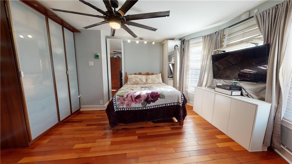 3216 Glenwood Road Brooklyn, NY 11210 - Photo 16 of 50 a room with wooden floor and furniture