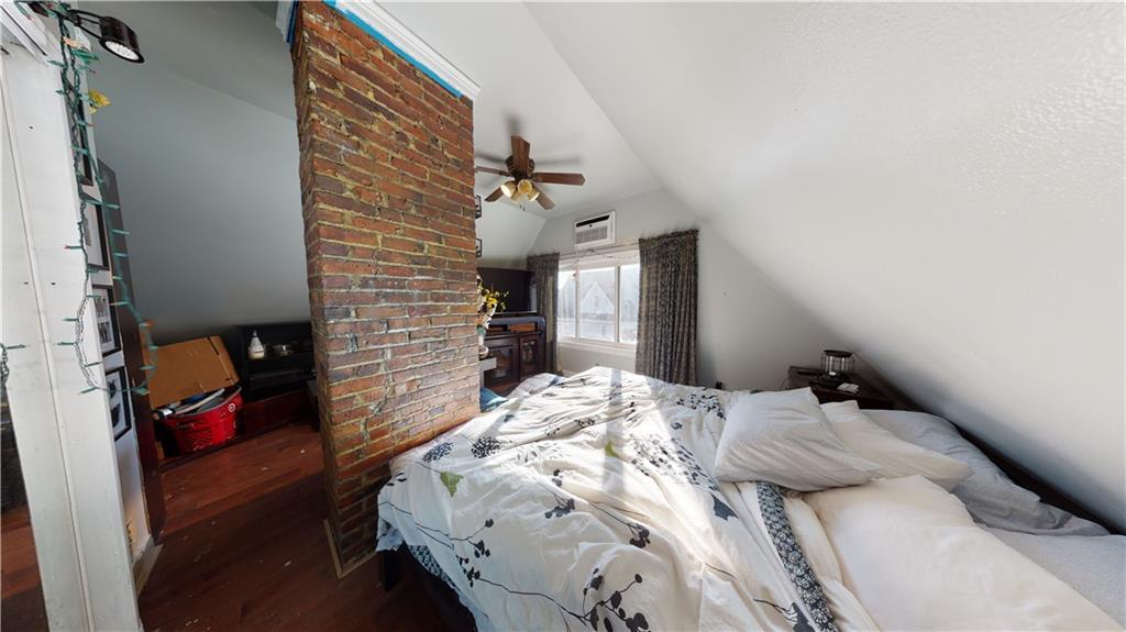 3216 Glenwood Road Brooklyn, NY 11210 - Photo 19 of 50 a bedroom with a bed and a window