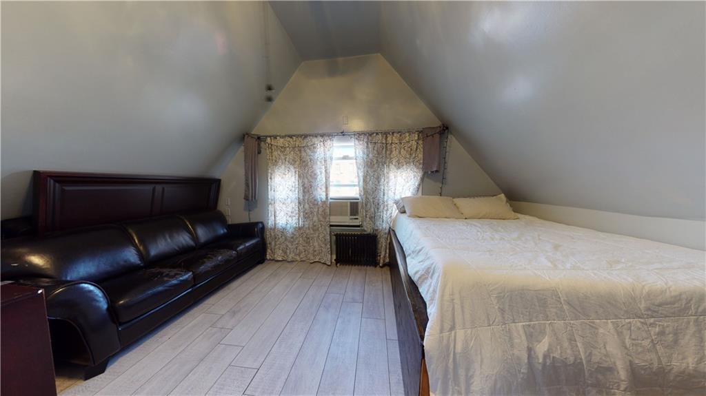 3216 Glenwood Road Brooklyn, NY 11210 - Photo 24 of 50 a bed room with a bed and a window