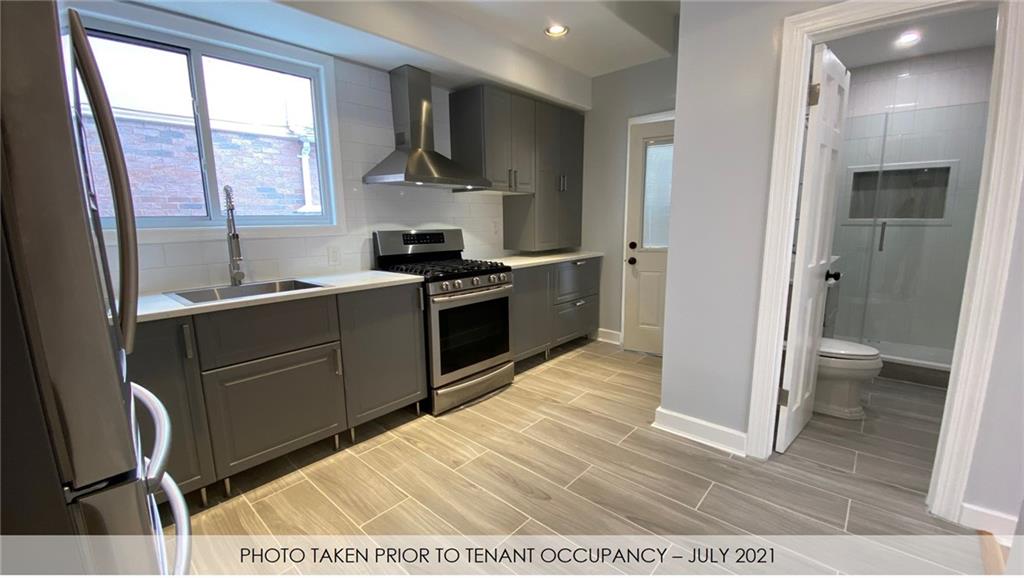 3216 Glenwood Road Brooklyn, NY 11210 - Photo 43 of 50 a kitchen with stainless steel appliances granite countertop a sink stove and refrigerator