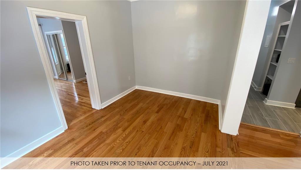 3216 Glenwood Road Brooklyn, NY 11210 - Photo 48 of 50 a view of a hallway with wooden floor