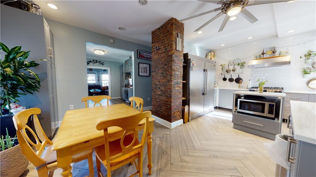 3216 Glenwood Road Brooklyn, NY 11210 - Photo 5 of 50 a view of a dining room with furniture and a kitchen