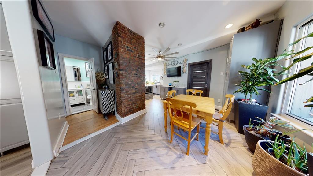3216 Glenwood Road Brooklyn, NY 11210 - Photo 8 of 50 a living room with furniture a fireplace and a potted plant