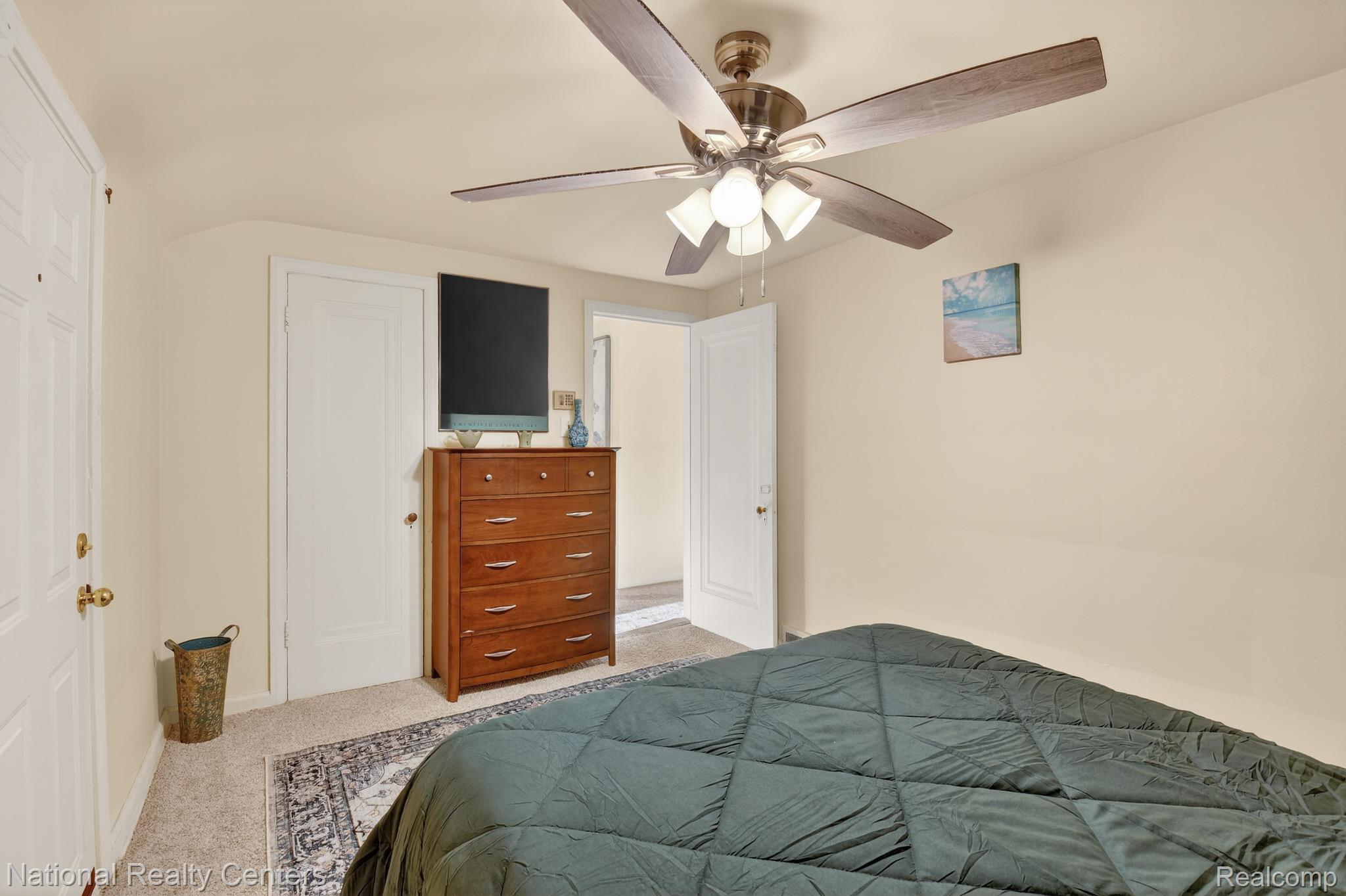3956 Harvard Road Detroit, MI 48224 - Photo 31 of 44 Bedroom featuring carpet floors, a ceiling fan, and a closet