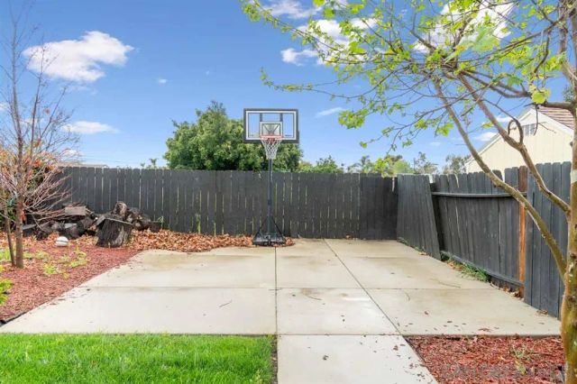 a front view of a house with a garden and yard
