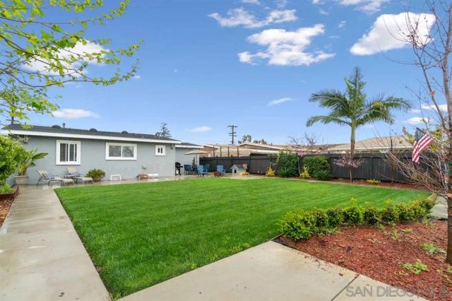 a front view of house with yard and seating area