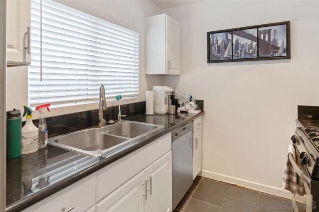 a kitchen with a sink and a window