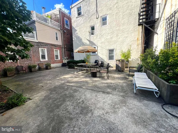 a view of a building with sitting area