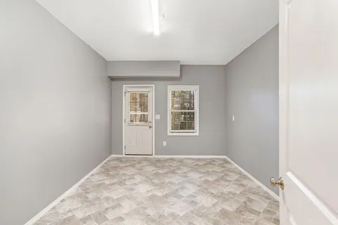 a view of a big room with windows