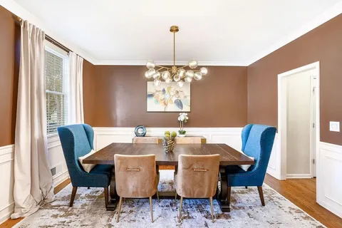a view of a dining room with furniture window and outside view
