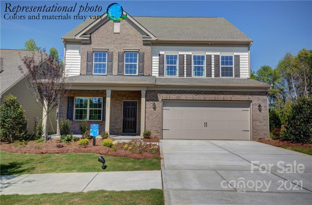 116 Tackle, Unit DRIVE 266 Troutman, NC 28166 - Photo 1 of 15 a front view of a house with garden