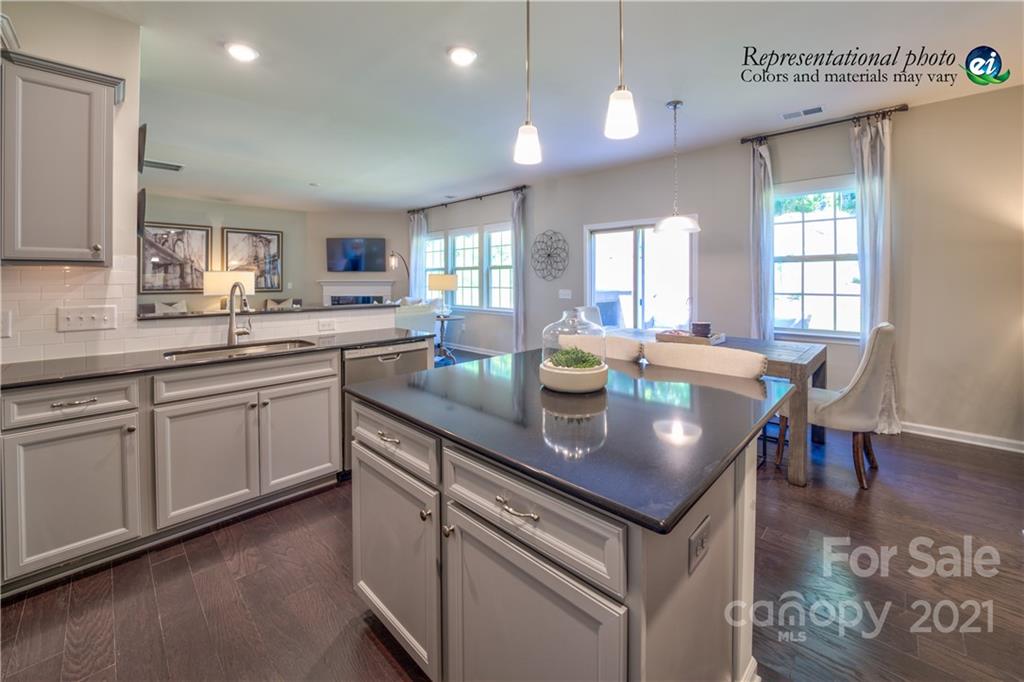 116 Tackle, Unit DRIVE 266 Troutman, NC 28166 - Photo 6 of 15 a kitchen with lots of counter space sink and dining table