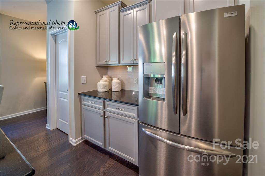 116 Tackle, Unit DRIVE 266 Troutman, NC 28166 - Photo 7 of 15 a kitchen with stainless steel appliances a refrigerator and a hard wood floor