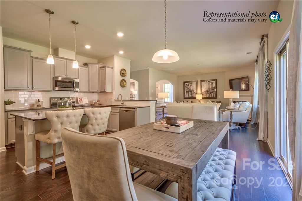 116 Tackle, Unit DRIVE 266 Troutman, NC 28166 - Photo 9 of 15 a large kitchen with a table and chairs